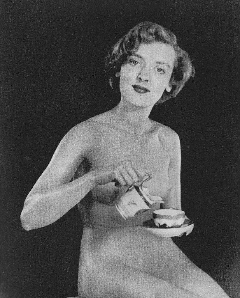 Nude woman drinking tea.