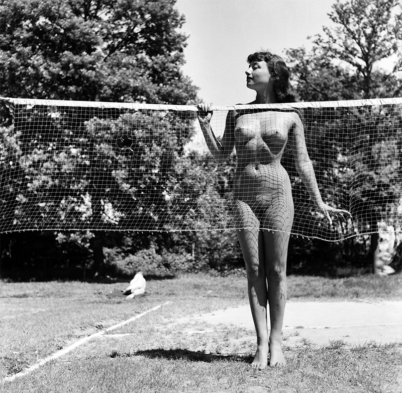 Photograph of a naked Pamela Green on the badminton court at Spielplatz